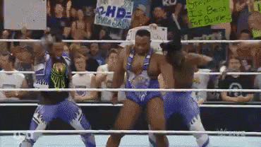 Wrestlers Dancing In Ring With RHD Sign GIF
