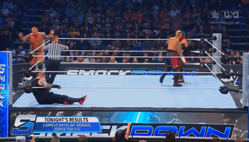 Wrestlers In A Wrestling Ring With The Words Tonight 'S Results GIF
