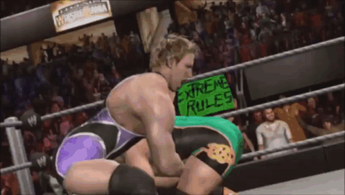 Wrestlers in Ring With Extreme Rules Sign