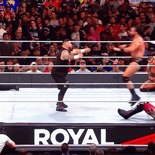 Wrestlers in Ring with Royal Sign