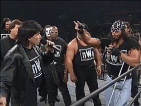 Wrestlers Standing in Ring NWO Shirt