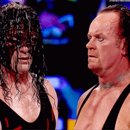 Wrestlers Standing Next to Each Other