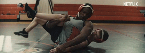 Wrestlers Wrestling in Gym