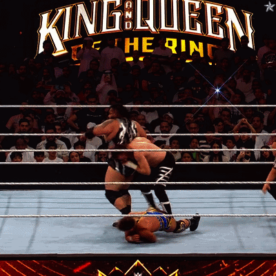 Wrestling Match Under King Queen Sign