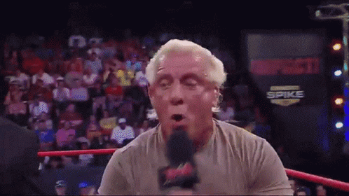 Wrestling Ring Man Talking Into Microphone