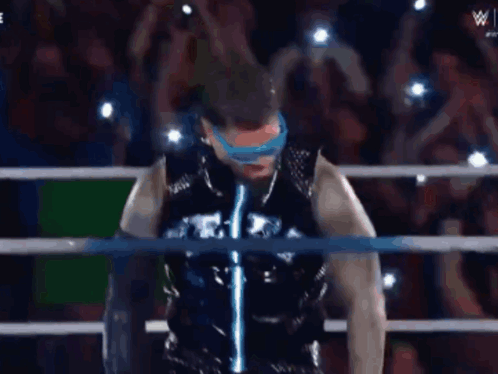 Wrestling Ring Man With Sunglasses and Black Jacket