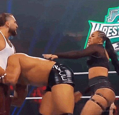 Wrestling Woman Holding Man's Butt