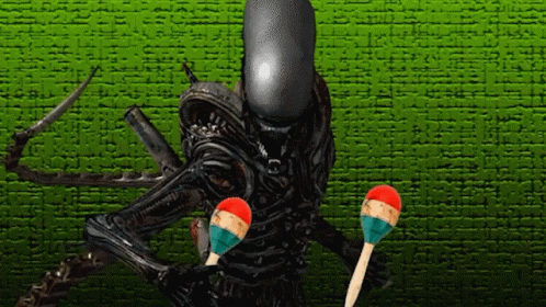 Xenomorph Playing Jingle Stick GIF