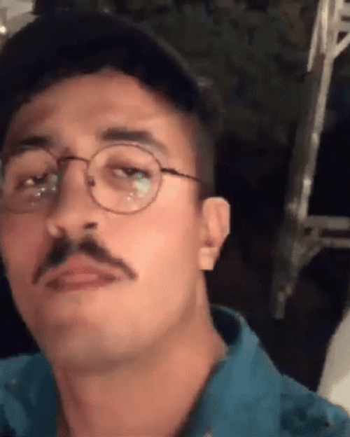 Yazid Moistening Mustache With Saliva GIF