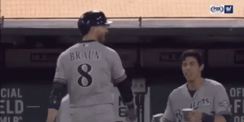 Yelich Receives Glass Of Water From Teammate GIF