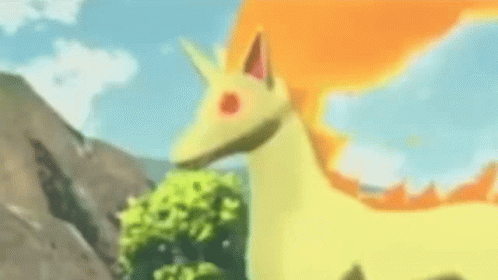 Yellow and Orange Pokémon Standing in Grass