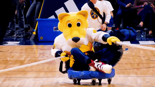 Yellow And White Mascot Riding Blue Scooter GIF