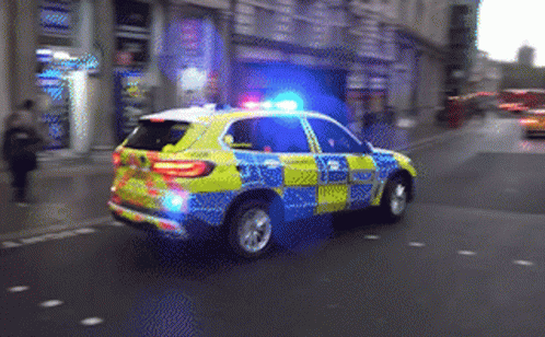 Yellow Blue Police Car Patrolling GIF