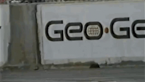 Yellow Car Driving Past Go Sign