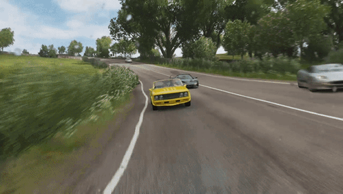 Yellow Car Driving With AEC License Plate