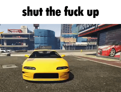 Yellow Car Parked in Front of Building Saying Shut the Fuck Up