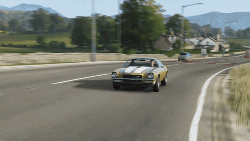 Yellow Car with White Stripes Driving