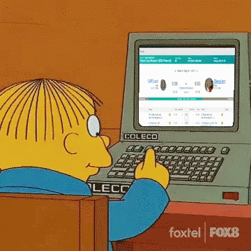 Yellow Cartoon Character Typing on Coleco Computer