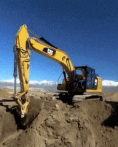 Yellow Cat Excavator Digging Hole In Sand GIF