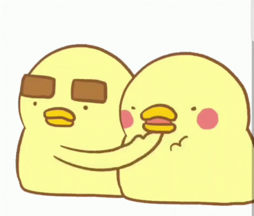 Yellow Chickens Standing Next to Each Other