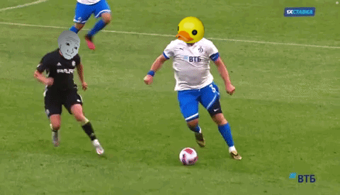 Yellow Duck Head Soccer Player Kicking Ball