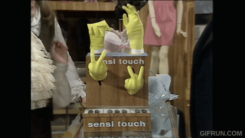 Yellow Gloves Touching Sensi Touch Box