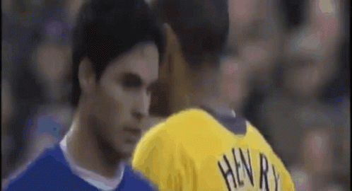 Yellow Henry Jersey Man Talking to Blue Shirt