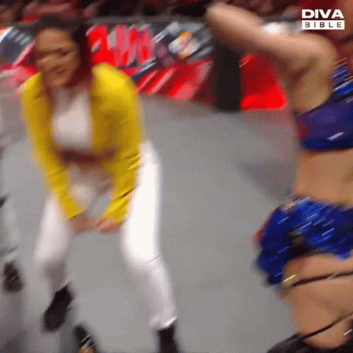Yellow Jacket Woman Dancing With Blue Bikini Woman
