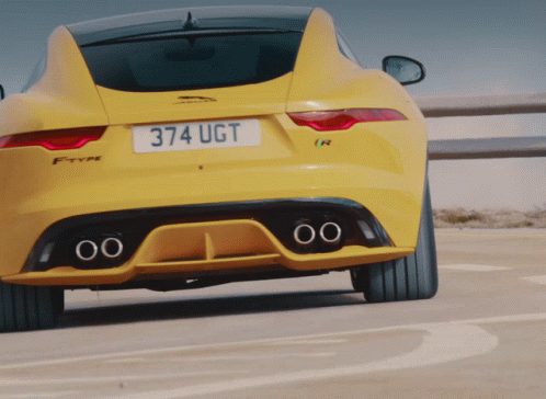 Yellow Jaguar Car With License Plate 374 Ugt