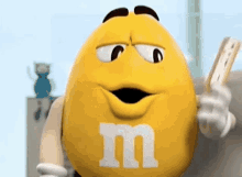 Yellow M And M's Using Fan GIF
