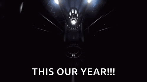 Yellow Object Flying Through Dark Room Saying This Our Year