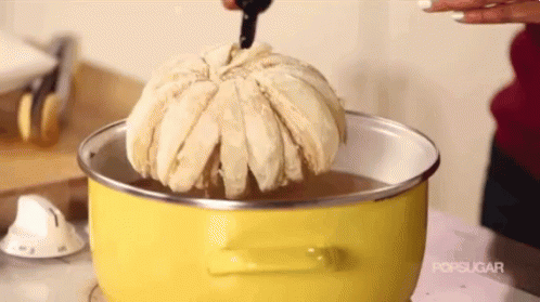 Yellow Pot With Water and Bread