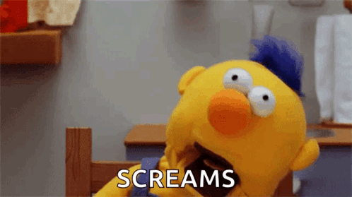 Yellow Puppet With Blue Mohawk Screaming GIF