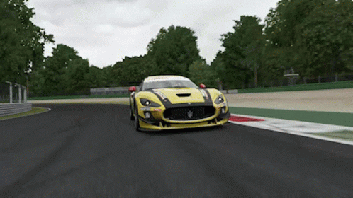 Yellow Race Car Driving on Track