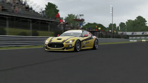 Yellow Race Car Number 23 Driving On Track GIF