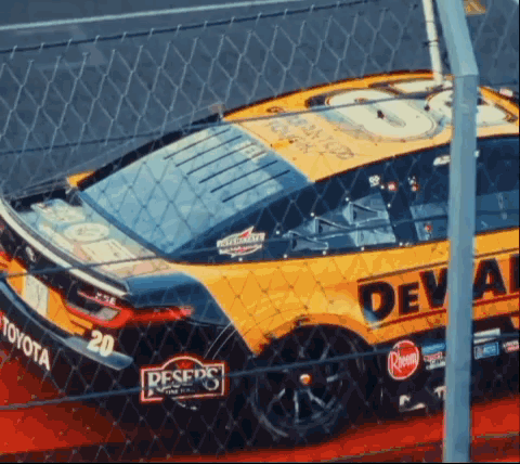 Yellow Race Car With Deval On Side GIF