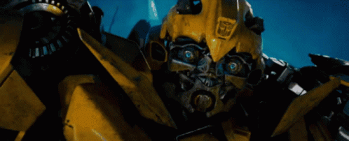 Yellow Robot With Transformers Logo