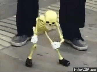 Yellow Skeleton Next to Person's Feet