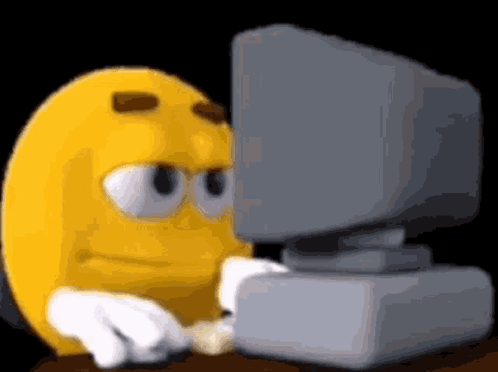 Yellow Smiley Looking At Computer Monitor GIF