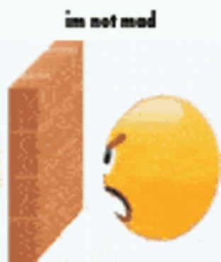 Yellow Smiley Next to Brick Wall Says I'm Not Mad