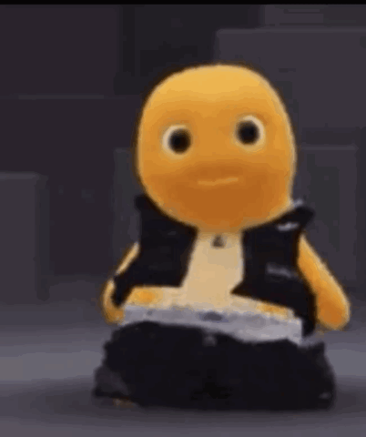 Yellow Stuffed Animal in Black Vest and Pants Sitting