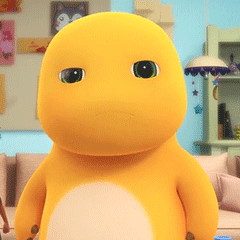 Yellow Stuffed Animal With Green Eyes on Couch