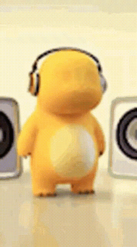 Yellow Stuffed Animal With Headphones By Speakers GIF