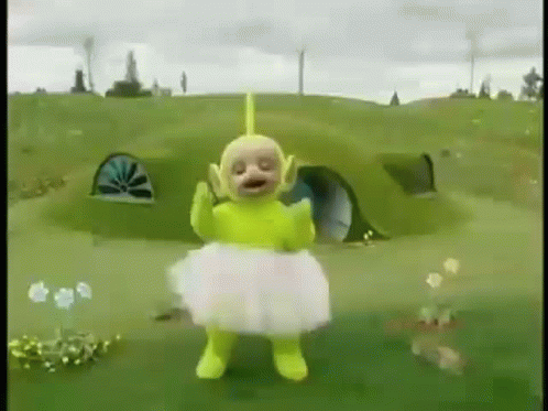 Yellow Teletubbies in White Tutu Standing in Field