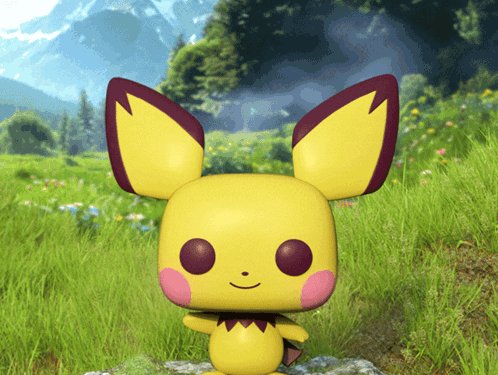 Yellow Toy With Red Ears Standing In Grass GIF