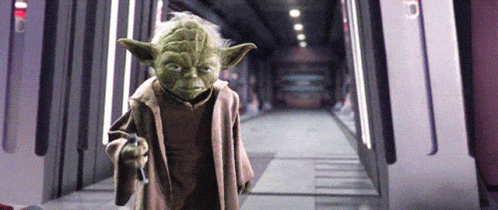 Yoda from Star Wars Holding Gun