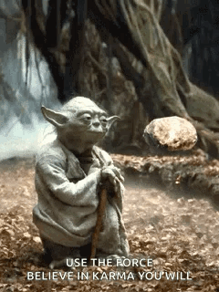 Yoda Holding Cane and Rock