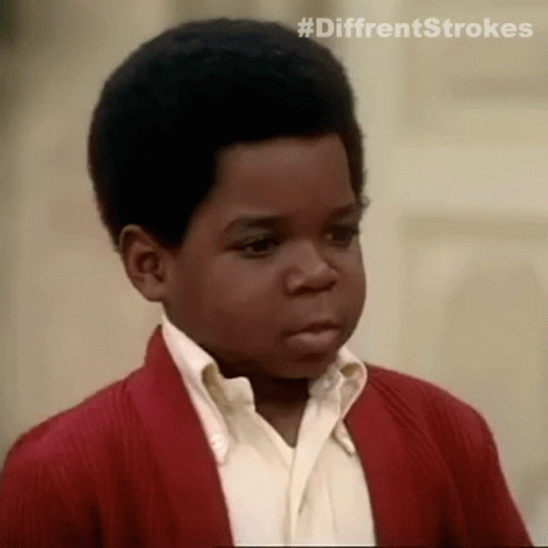 Young Black Boy in Red Sweater Making Funny Face