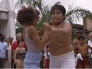 Young Boy And Girl Performing Salsa GIF