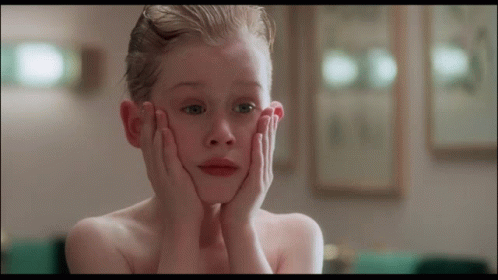 Young Boy Covering Face